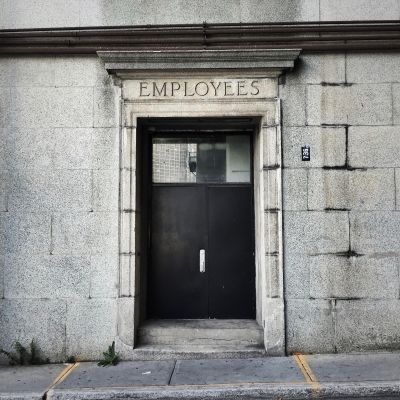 Employees access door. Source: Unsplash - Olivier Collet. Employees access door. Source: Unsplash - Olivier Collet.
