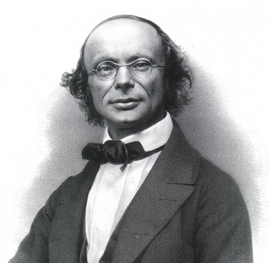 El físic alemany Wilhelm Eduard Weber (1804-1891) va ser un investigador precoç i amb només vint anys, quan encara era estudiant, ja va publicar el seu primer llibre, sobre teoria ondulatòria. Weber va centrar majoritàriament els seus esforços en el camp de l'acústica. L'any 1833, juntament amb el genial Carl Gauss, va desenvolupar el primer telègraf electromagnètic. Retrat.